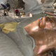 Image for article titled This Life-Size Statue of Liberty Replica Shows Her Pre-Patina Shine